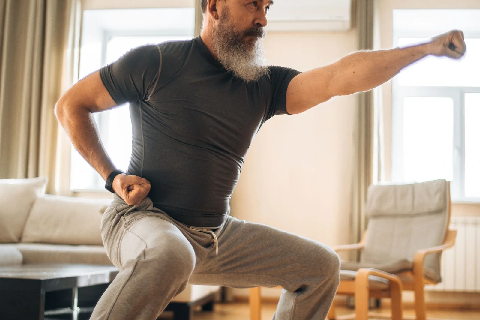 Mature man doing a comfortable gentle stretch